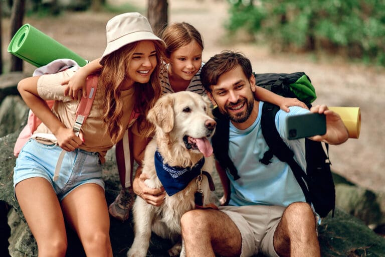 Group of people outdoors with a dog