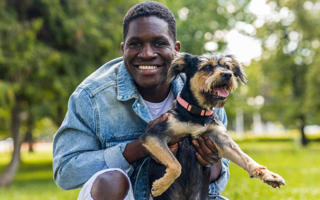 Man poses with dog