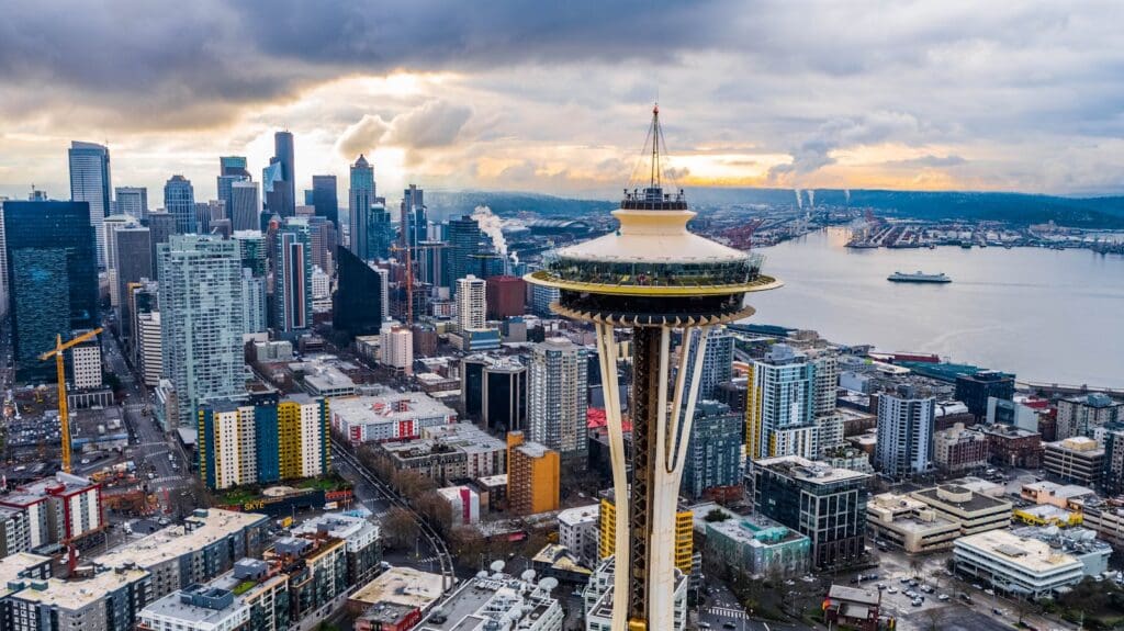 Stunning aerial shot of Seattle's skyline featuring the iconic Space Needle at sunset.