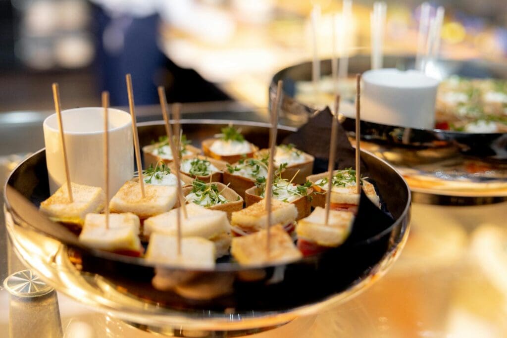 Delicious canapes elegantly arranged on a platter, perfect for upscale events and gatherings.